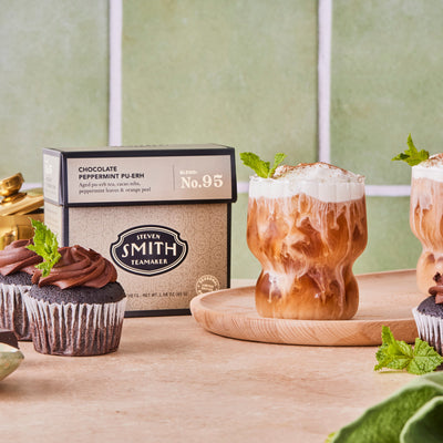 Glass of Chocolate Peppermint Pu-erh Glacier with cold foam poured over top.