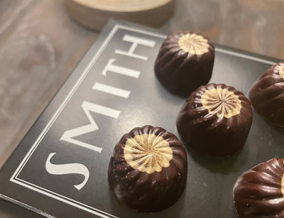 Several Chai Tea Bonbons on a Smith Teamaker black tea box.