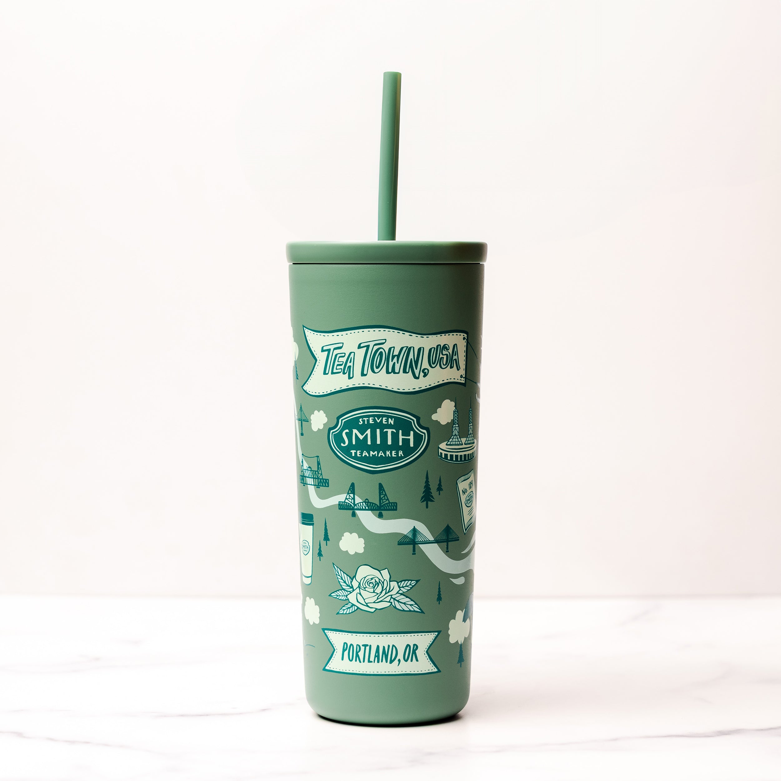 Green tumbler with 'Tea Town USA' branding on a white background