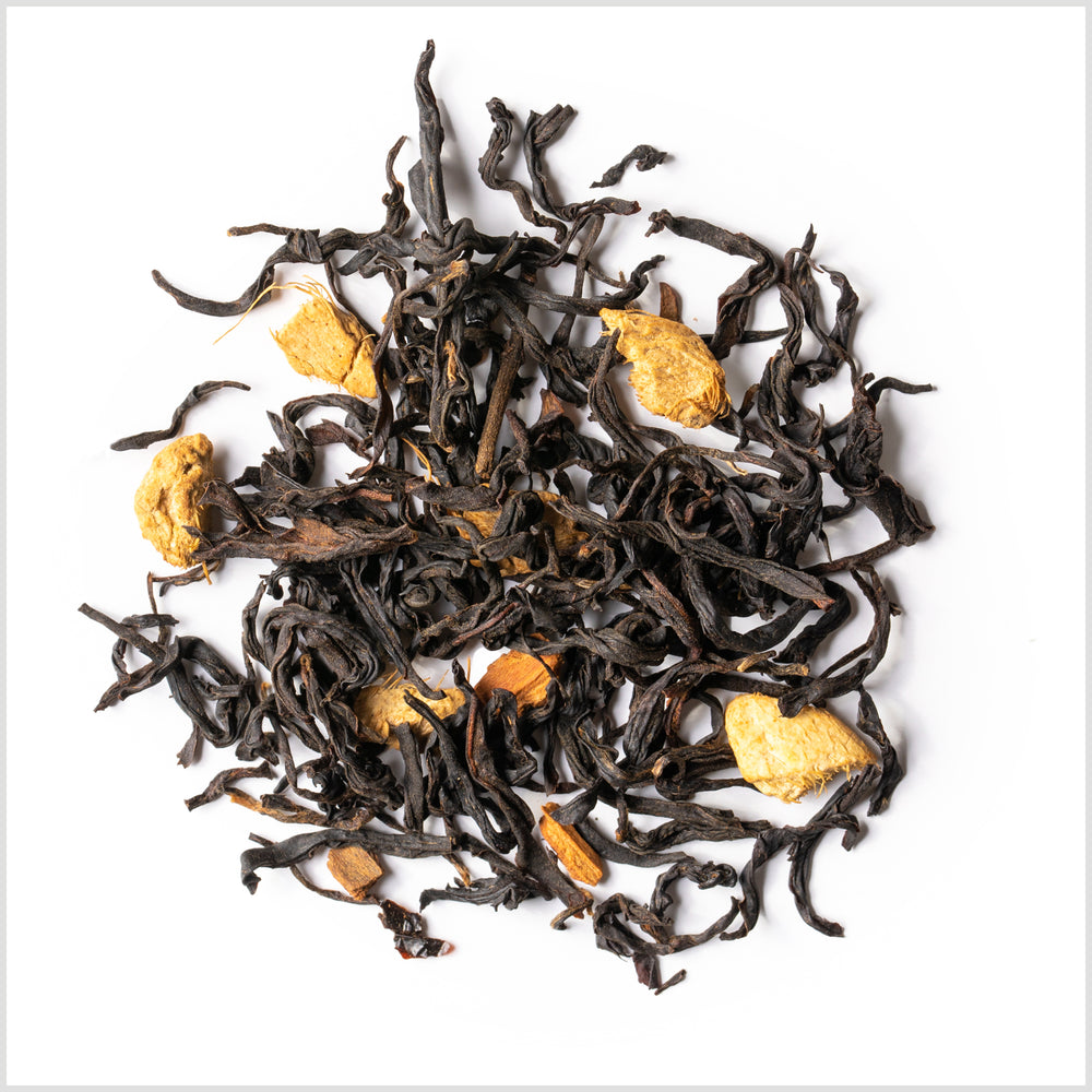 Pile of loose leaf Autumn Leaves tea to show full-leaf Yunnan black tea, dried ginger, cinnamon and clove.
