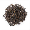Circular pile of loose black tea.