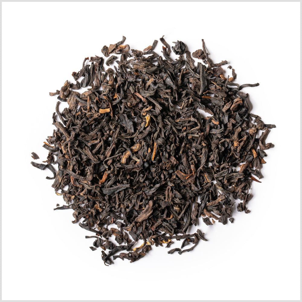 Circular pile of loose black tea.