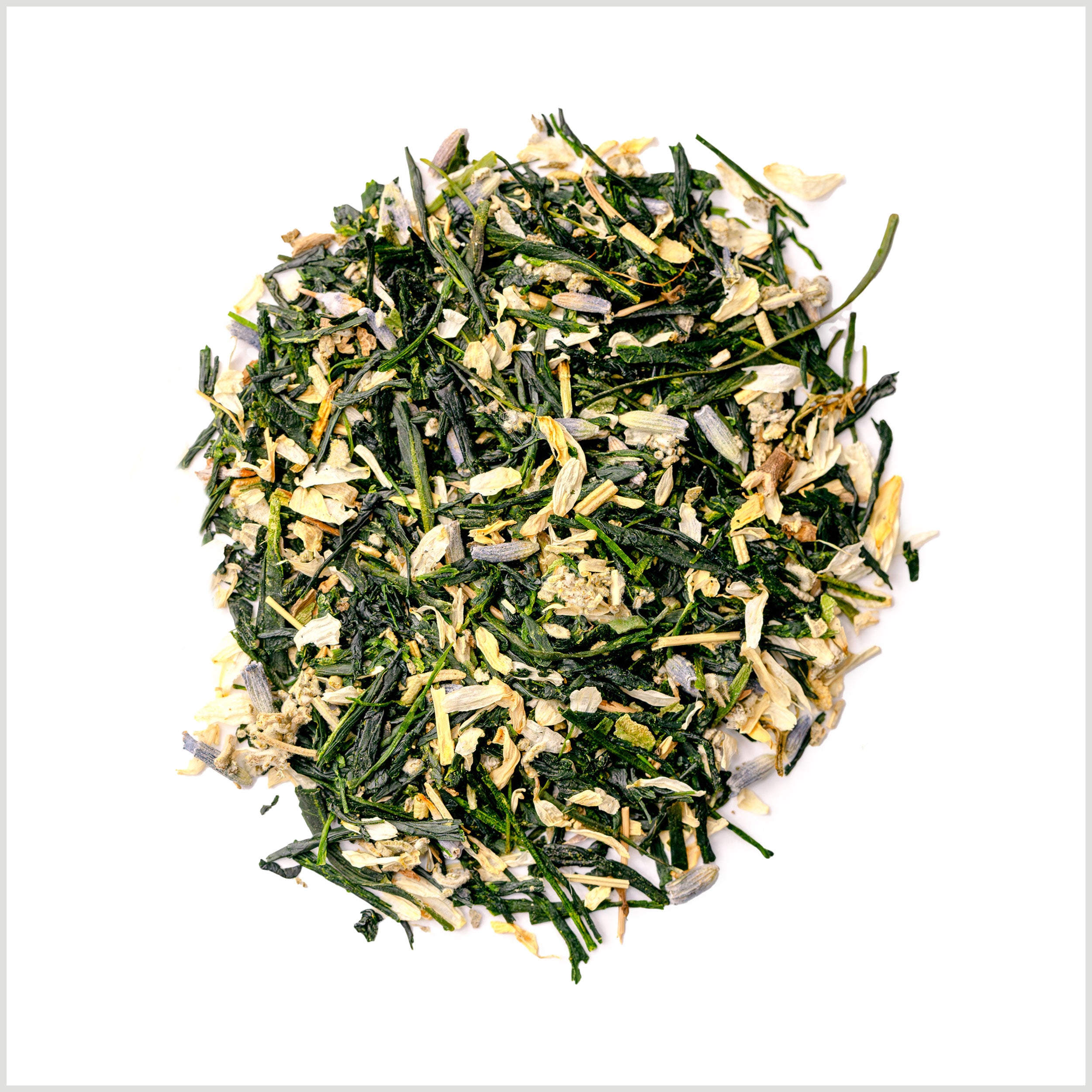 Pile of loose leaf Garden Party green tea to show gyokuro green tea, lavender, hyssop, rosemary and chamomile.