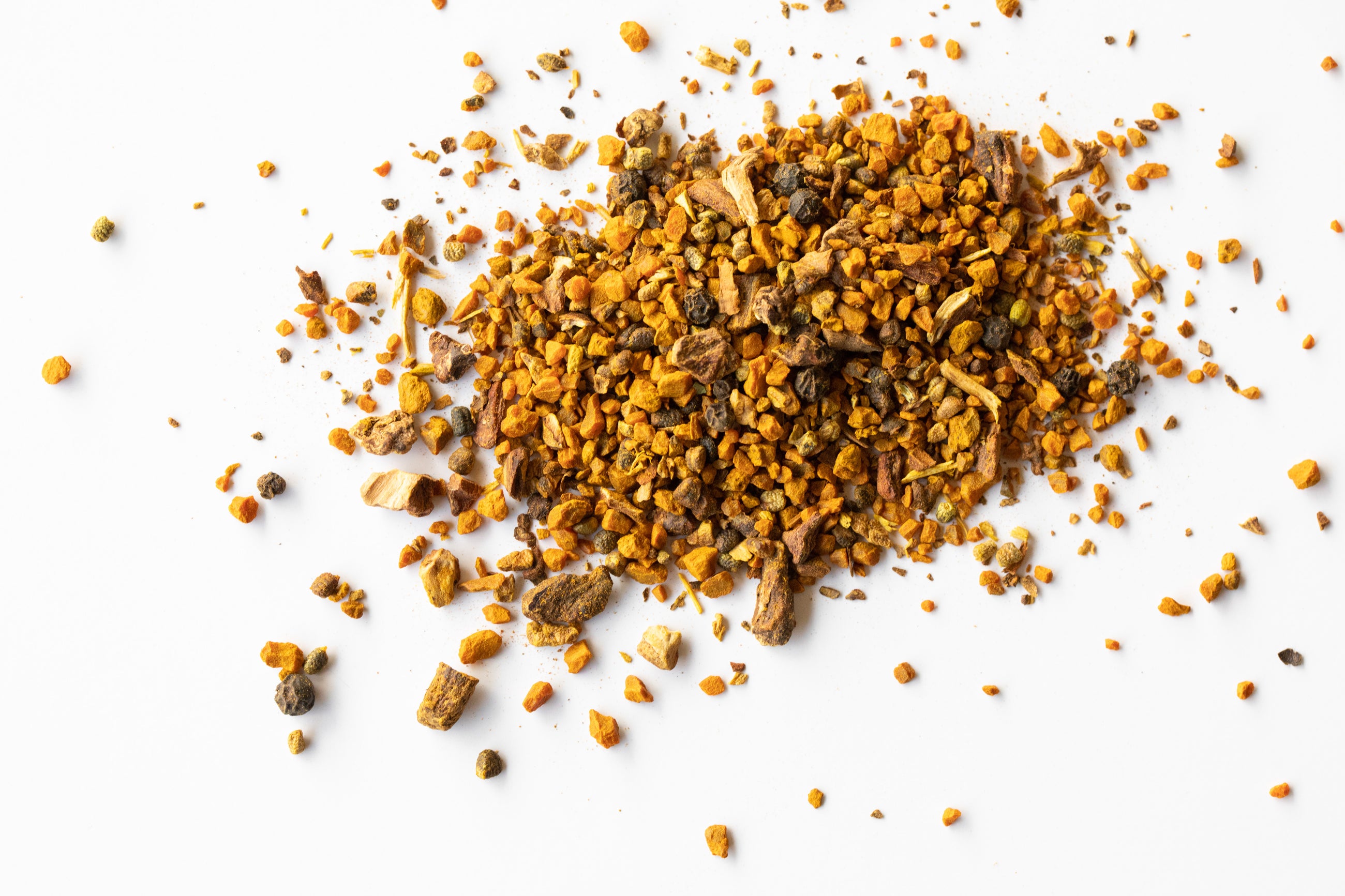 Pile of loose Golden Light blend to show ingredients like turmeric and black pepper.