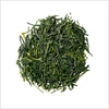 Loose leaf gyokuro green tea to show bright green, flat tea leaves.