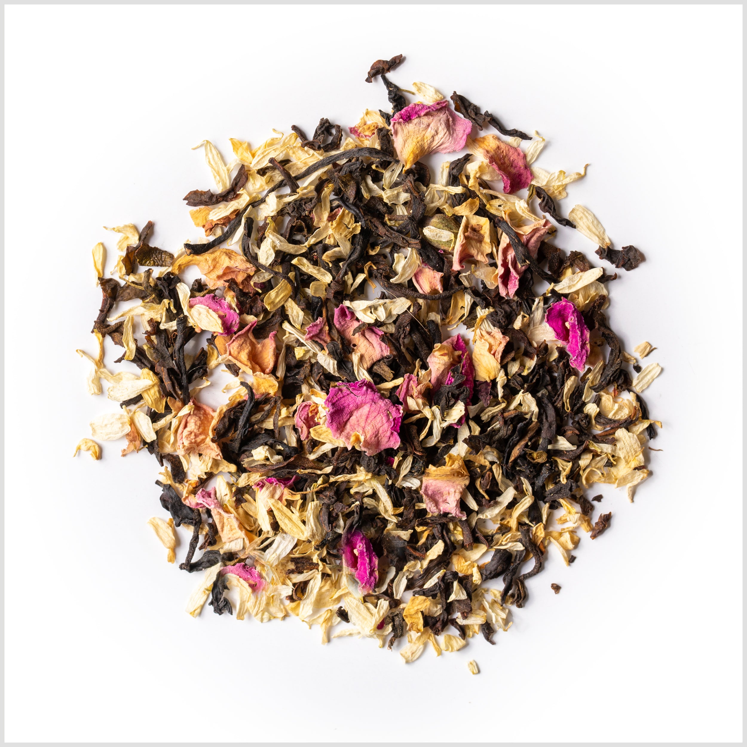 Pile of loose leaf Lover's Leap to show full leaf black tea, chamomile petals and rose petals.