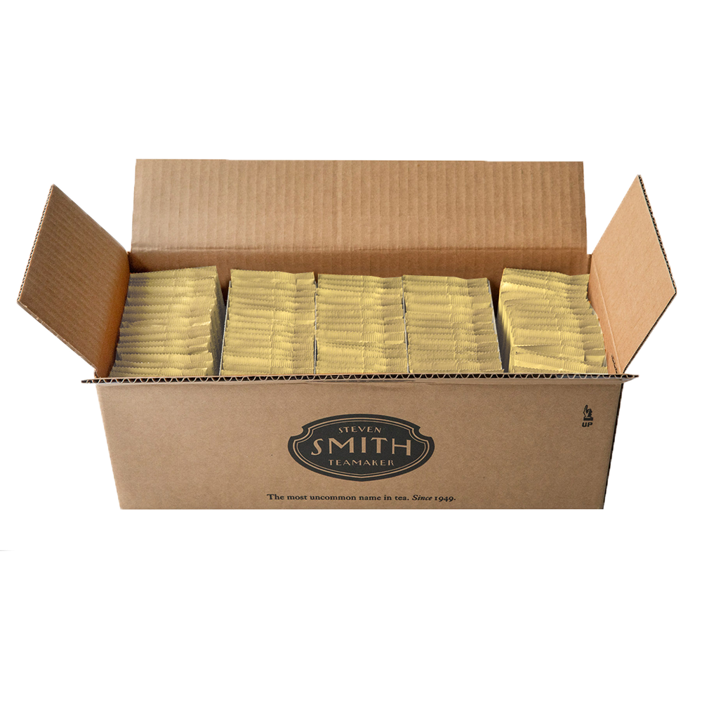 Cardboard box filled with 100 yellow sachets, featuring a brand logo on a white background.