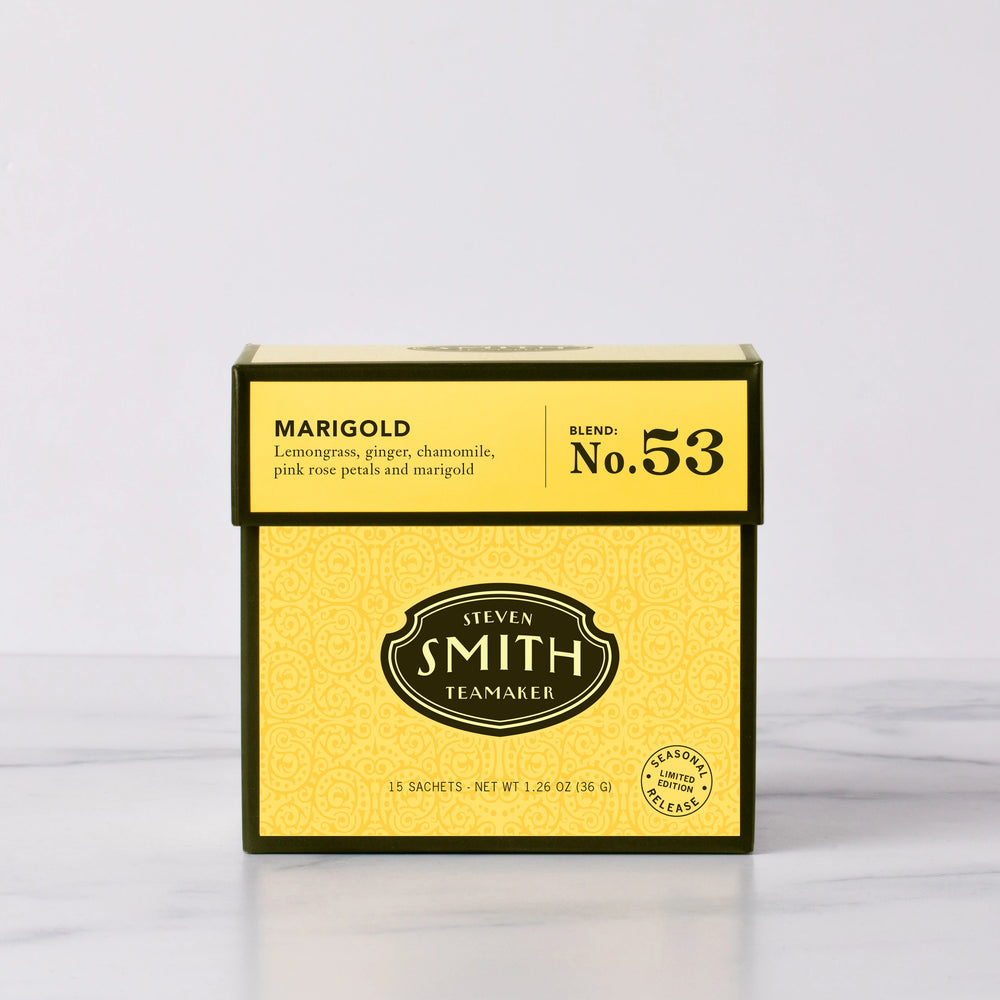Yellow box of Steven Smith Teamaker Marigold tea on a white background