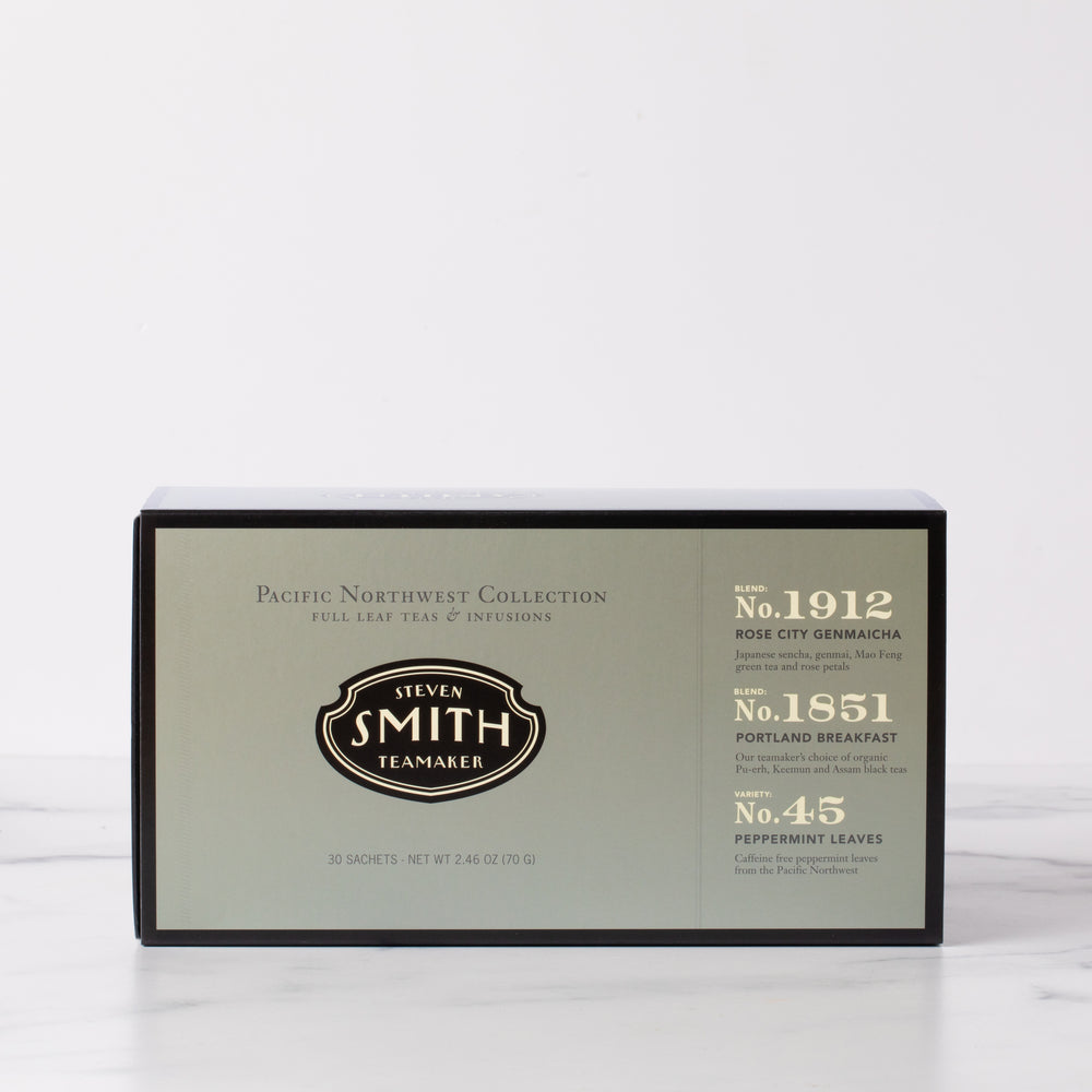 Dark silver box with black trim on marble background.