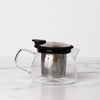 Glass teapot with stainless steel and black lid with spout and handle.