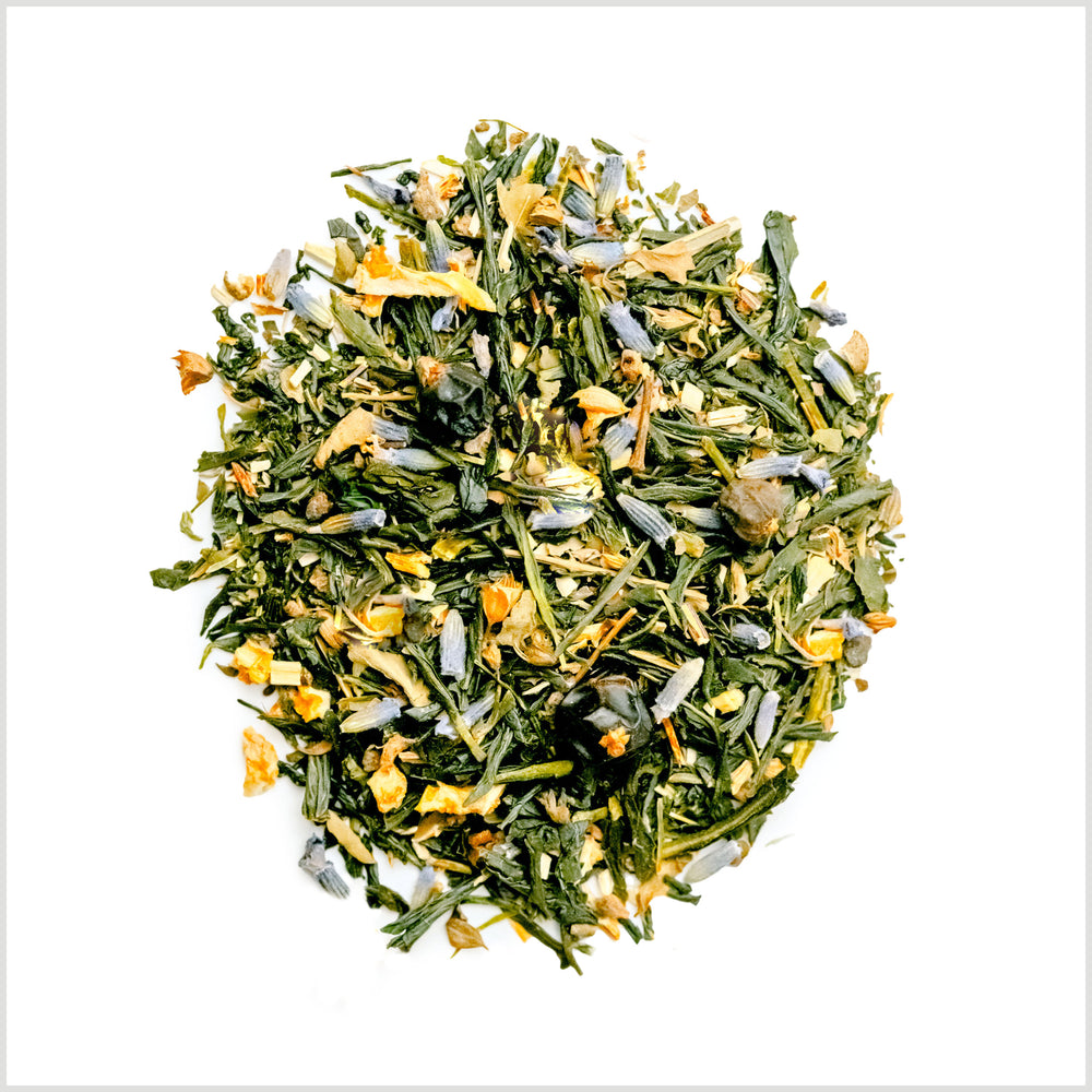 Pile of loose leaf Tokyo Twilight green tea to show full leaf green tea, lavender, green rooibos and tulsi.
