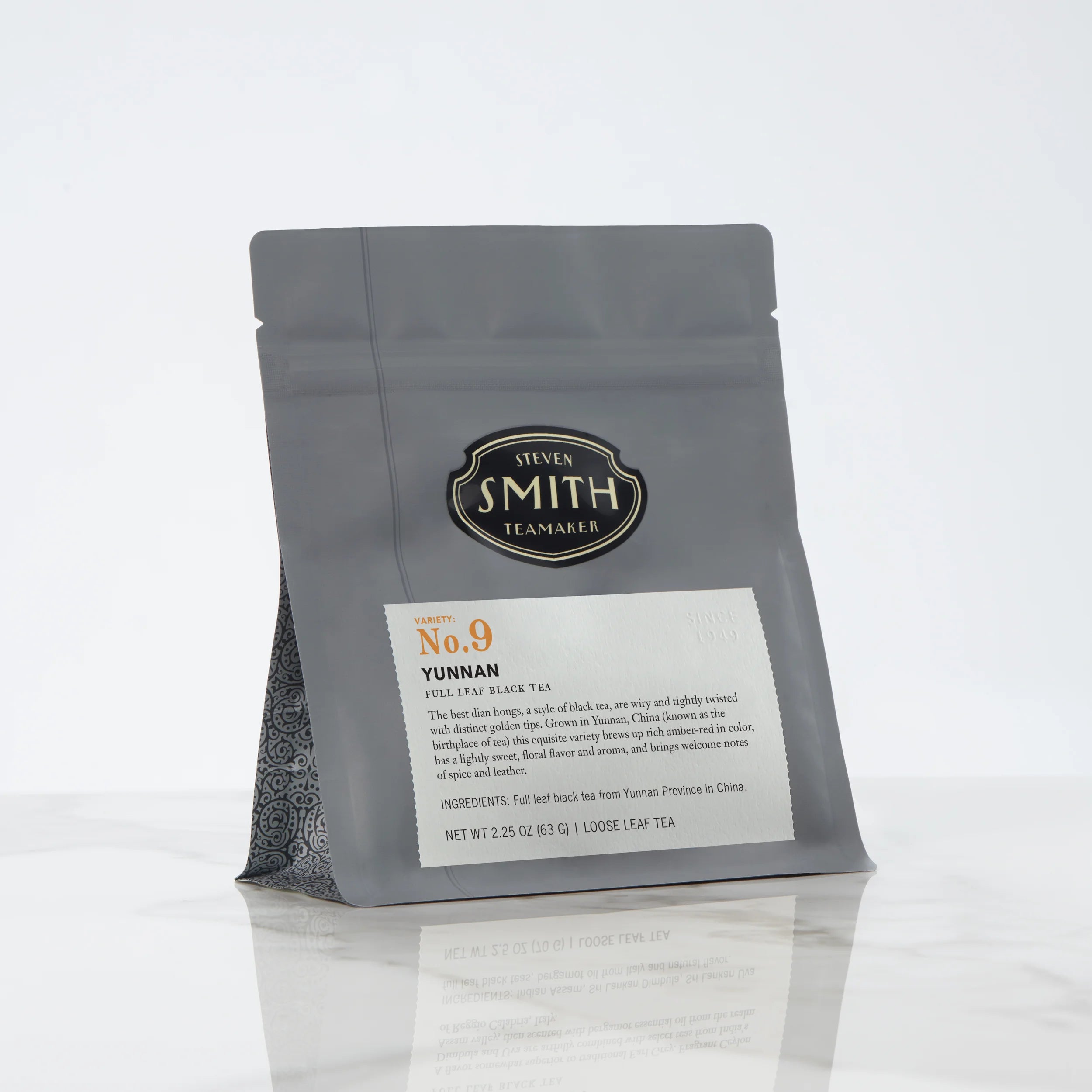 Black bag of loose leaf tea with Smith shield and Yunnan label
