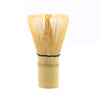 Bamboo matcha whisk with black thread.