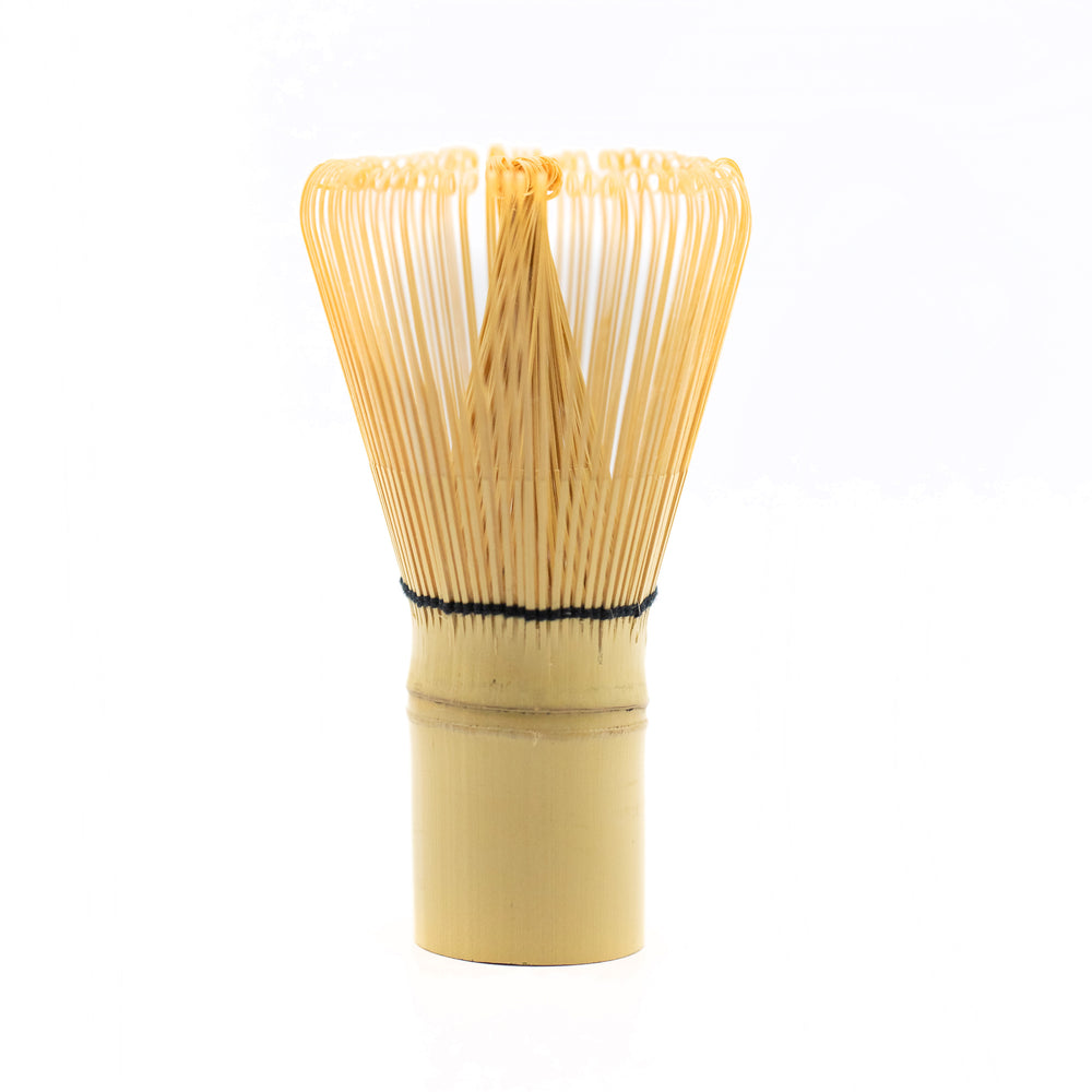 Bamboo matcha whisk with black thread.
