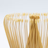 Bamboo matcha whisk with black thread.