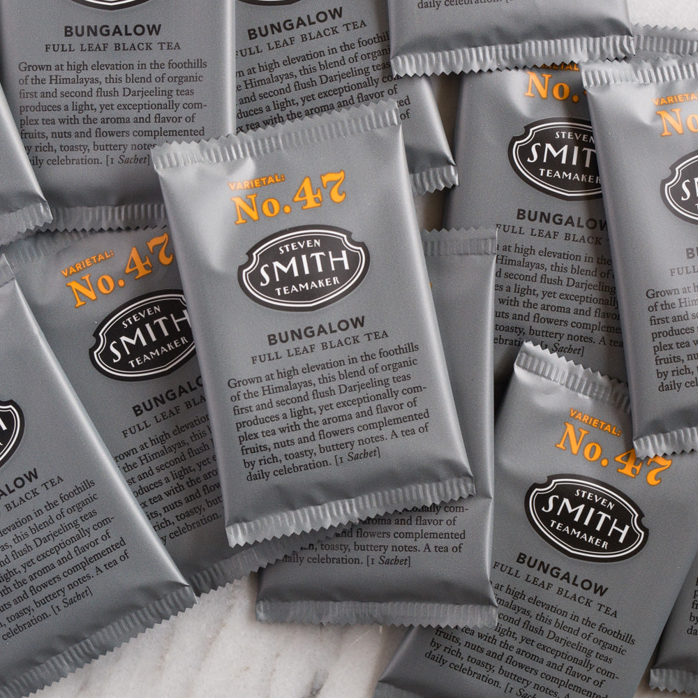 Pile of black wrapped tea sachets.