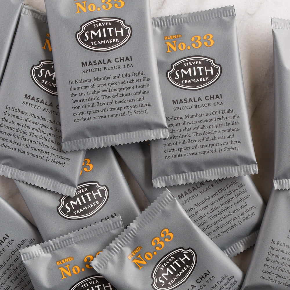 A pile of overwrapped sachets of Masala Chai black tea.